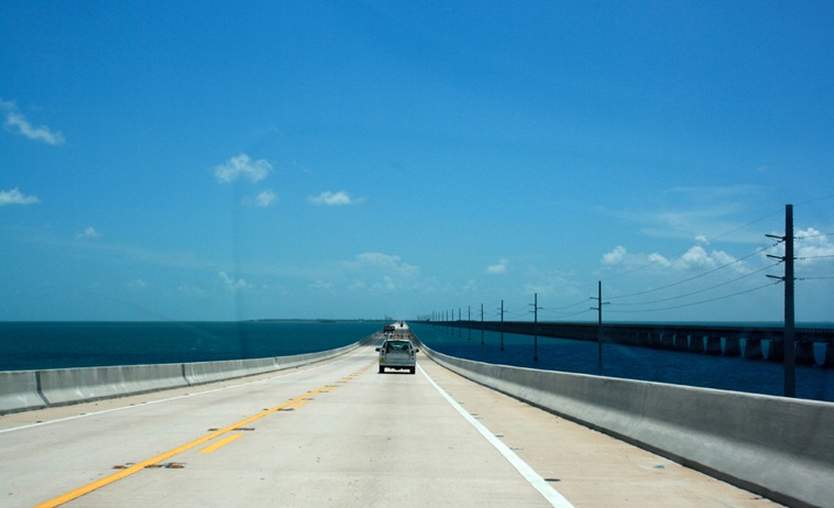 Photo of a car crossing a bridge